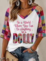 Women's In A World Where You Can Be Anything Be A Dolly Patchwork Print Half-Sleeve V-Neck T-Shirt